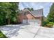 Spacious 3-car garage with an expansive driveway, perfect for a Gathering's parking needs at 225 Midenhall Way, Cary, NC 27513