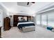 Spacious main bedroom featuring a bed, lamps, and windows for natural light at 225 Midenhall Way, Cary, NC 27513