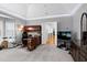 Spacious home office with tray ceilings, carpet flooring, and ample storage space at 225 Midenhall Way, Cary, NC 27513