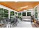 Sunroom with a wooden ceiling, lots of windows, tile floor, and a ceiling fan at 225 Midenhall Way, Cary, NC 27513