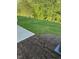 View of the lush backyard with green grass and mulch at 2299 Bay Minette Sta # 537, Apex, NC 27502