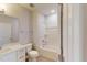Well-lit bathroom featuring white cabinets, a mirror, and a shower-tub combo at 2299 Bay Minette Sta # 537, Apex, NC 27502