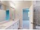 Modern bathroom features a sleek vanity with a large mirror, shower with glass door, and neutral color palette at 2299 Bay Minette Sta # 537, Apex, NC 27502