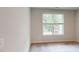 Bright bedroom with carpeted floors, a large window with outdoor views, and neutral walls at 2299 Bay Minette Sta # 537, Apex, NC 27502