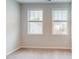 Bright bedroom featuring large windows offering exterior views and neutral carpeting at 2299 Bay Minette Sta # 537, Apex, NC 27502