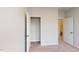 Neutral bedroom featuring an open closet with rod and view into the attached bathroom at 2299 Bay Minette Sta # 537, Apex, NC 27502
