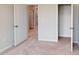 Bedroom featuring an open closet, doorway, and neutral carpeting at 2299 Bay Minette Sta # 537, Apex, NC 27502