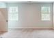 Bright bedroom with neutral carpet, dual windows, and a closet at 2299 Bay Minette Sta # 537, Apex, NC 27502