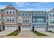 Attractive townhouse exteriors with neat landscaping, driveways, and multi-toned facades at 2299 Bay Minette Sta # 537, Apex, NC 27502