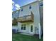 Back exterior of home showcasing deck space and yard at 2299 Bay Minette Sta # 537, Apex, NC 27502