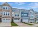 Stylish townhome row showcasing distinct color schemes and inviting curb appeal at 2299 Bay Minette Sta # 537, Apex, NC 27502