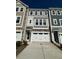 Charming townhouse with a two-car garage and neutral colored exterior at 2299 Bay Minette Sta # 537, Apex, NC 27502