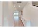 Hallway with built-in storage cabinets and hardwood floors at 2299 Bay Minette Sta # 537, Apex, NC 27502