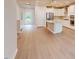Modern kitchen featuring an island, stainless steel appliances, and hardwood floors at 2299 Bay Minette Sta # 537, Apex, NC 27502
