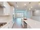 Bright kitchen featuring stainless steel appliances, white cabinetry, and center island at 2299 Bay Minette Sta # 537, Apex, NC 27502