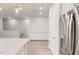 Open floor plan with white cabinets, hardwood flooring, stainless steel refrigerator at 2299 Bay Minette Sta # 537, Apex, NC 27502