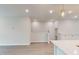 Bright living room features modern white cabinets, and an open floor plan at 2299 Bay Minette Sta # 537, Apex, NC 27502