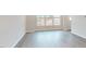 Bright living room with hardwood floors and large windows at 2299 Bay Minette Sta # 537, Apex, NC 27502