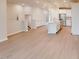 Open living room and kitchen layout with island and stainless steel appliances at 2299 Bay Minette Sta # 537, Apex, NC 27502