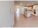 Open-concept living space that includes hardwood flooring leading to the kitchen at 2299 Bay Minette Sta # 537, Apex, NC 27502