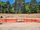 New construction lot with silt fence and trees at 2396 Picual Way # 32, New Hill, NC 27562