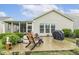 Landscaped backyard with a patio, grill, and view of the house, perfect for entertaining or relaxing at 2410 Kinglass Dr, Fuquay Varina, NC 27526