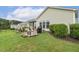 Backyard with a patio, grill, and well-maintained lawn, creating a serene outdoor space at 2410 Kinglass Dr, Fuquay Varina, NC 27526