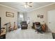 Versatile bedroom with a comfortable reading chair, desk, and neutral decor at 2410 Kinglass Dr, Fuquay Varina, NC 27526