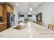 Bright and airy kitchen island with quartz countertops, seating, and stainless-steel appliances at 2410 Kinglass Dr, Fuquay Varina, NC 27526