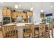 Stylish kitchen featuring quartz countertops, a center island with seating, and modern appliances at 2410 Kinglass Dr, Fuquay Varina, NC 27526