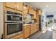 A beautifully updated kitchen with stainless steel appliances, granite countertops, and light wood cabinets at 2410 Kinglass Dr, Fuquay Varina, NC 27526
