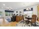 Light-filled living room with hardwood floors, large windows, stylish blue curtains, and comfortable seating at 2410 Kinglass Dr, Fuquay Varina, NC 27526