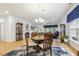 Open-concept living area with fireplace, hardwood floors, and abundant natural light at 2410 Kinglass Dr, Fuquay Varina, NC 27526