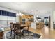 Open-concept living space features a dining area, kitchen with island seating, and modern finishes at 2410 Kinglass Dr, Fuquay Varina, NC 27526