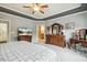 Spacious main bedroom featuring dual dressers and a vanity with a view of the ensuite bathroom at 2410 Kinglass Dr, Fuquay Varina, NC 27526