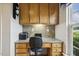Dedicated office space with built-in desk, drawers, and natural light from the window at 2410 Kinglass Dr, Fuquay Varina, NC 27526
