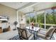 Inviting sunroom with large windows, comfortable seating, and a ceiling fan, perfect for relaxation at 2410 Kinglass Dr, Fuquay Varina, NC 27526