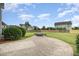 Spacious backyard featuring a stone patio and lush landscaping perfect for outdoor living at 2507 Belvinwood Dr, Fuquay Varina, NC 27526
