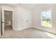Bright bedroom featuring carpet, closet space, and lots of natural light at 2507 Belvinwood Dr, Fuquay Varina, NC 27526