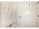 Mudroom featuring hooks, bench seating, and a door to the outside at 2507 Belvinwood Dr, Fuquay Varina, NC 27526