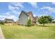 Charming two-story home with manicured lawn, mature trees, and beautiful curb appeal at 2507 Belvinwood Dr, Fuquay Varina, NC 27526