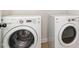 A laundry room features a white washing machine and a dryer at 2507 Belvinwood Dr, Fuquay Varina, NC 27526