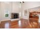 Spacious living room with hardwood floors, stone fireplace, and soaring ceilings creating an open atmosphere at 2507 Belvinwood Dr, Fuquay Varina, NC 27526