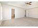 Spacious main bedroom with neutral carpet and doorways to the bathroom and hallway at 2507 Belvinwood Dr, Fuquay Varina, NC 27526