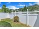 Backyard features a white wooden fence and green grass with blue sky background at 2513 Asher View Ct, Raleigh, NC 27606