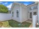 Back of house featuring a small fenced in back yard, green grass and trees at 2513 Asher View Ct, Raleigh, NC 27606