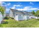 A fenced backyard features healthy green grass and ample sunlight at 2513 Asher View Ct, Raleigh, NC 27606