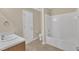 Bathroom features a tub/shower combo with tile flooring, and neutral color paint at 2513 Asher View Ct, Raleigh, NC 27606