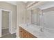 Bathroom featuring double sink vanity with modern lighting and fixtures at 2513 Asher View Ct, Raleigh, NC 27606