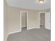 Bedroom featuring neutral paint, carpet, closet and an adjacent bathroom at 2513 Asher View Ct, Raleigh, NC 27606